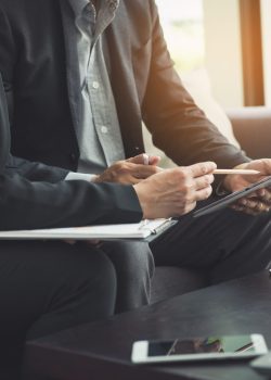Team work process. young business managers crew working with new startup project. labtop on wood table, typing keyboard, texting message, analyze graph plans.
